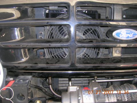 1996 Ford Bronco - Front view of a 1996 Ford Bronco grille, showing fans and a winch mechanism.