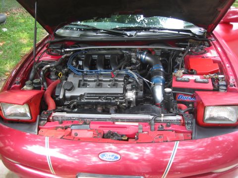 1995 Ford Probe - Engine bay view of a 1995 Ford Probe, showing the V6 engine and modifications.