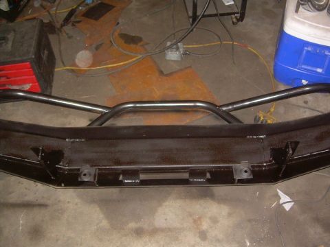 1993 Toyota 4Runner - A custom-fabricated front bumper with a brush guard is shown in a workshop setting.