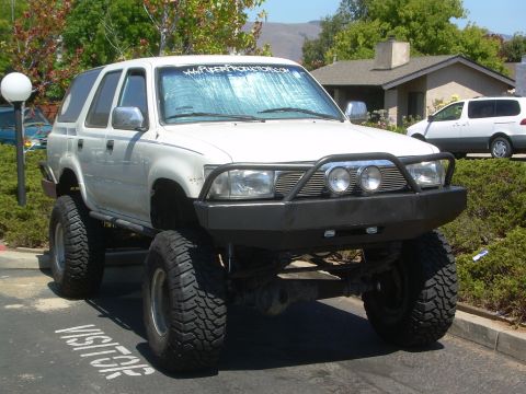 1993 Toyota 4Runner - Modified 1993 Toyota 4Runner features a custom front bumper and off-road tires.