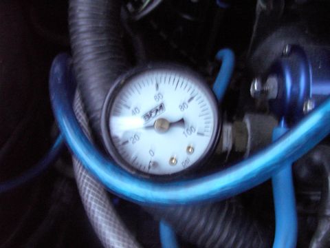 1989 Ford Probe - A fuel pressure gauge is shown with readings up to 100 psi.