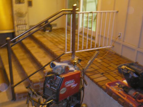 1999 Ford F-800 - Lincoln Electric Pro-Mig 135 welding machine on a brick patio.