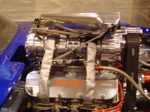 1979 Ford Bronco - Custom V8 engine a prominent supercharger and 'PRO-MAX' branding on the valve covers.