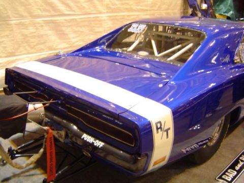 1979 Ford Bronco - This modified vehicle features a roll cage and drag racing slicks, indicating it's built for performance.