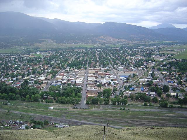 Aerial shot of a town with mountains in the background