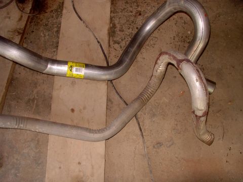 1990 Lincoln Town Car - There's the old uber-kinked 2 " Lincoln replacement tailpipe. Next to it is the Impala SS mandrel bent 2 1/2" unit from Dynomax. Pretty dar…