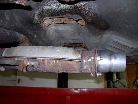 1990 Lincoln Town Car - To begin, after unbolting the old connector pipe, we bolted on the 3" to 2 1/2" reducer flange loosely.