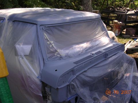 1978 Ford Bronco - This 1978 Ford Bronco is being prepped for paint, with its front end covered in plastic sheeting and primer.