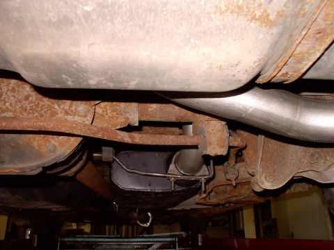 1990 Lincoln Town Car - Wish I had more lighting, but squint away and you can see how well the hanger/clamp positions the 2 1/2" Hooker Aerochamber muffler on the…