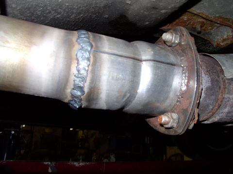 1990 Lincoln Town Car - Once the muffler was clamped in and the tailpipe was positioned where we wanted it, he welded up the connector pipe to the reducer bolted t…