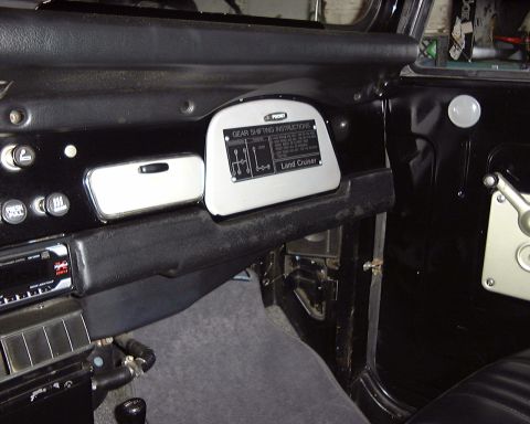 1974 Toyota Land Cruiser - The interior of a Land Cruiser shows a gear shifting instructions plate and a modern radio.