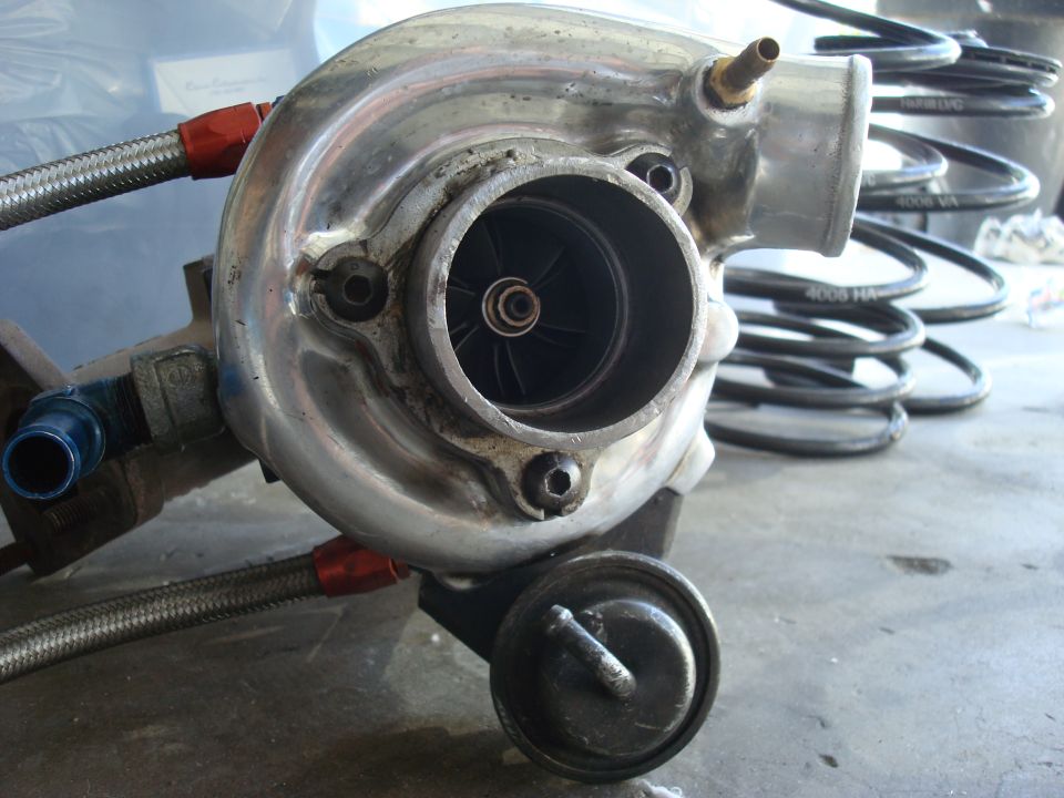 Front view of turbocharger compressor wheel and housing