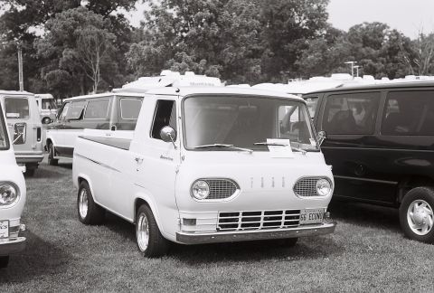1973 Ford Ranchero - White 1961 Ford Econoline pickup truck with a license plate reading '66 ECONO'.