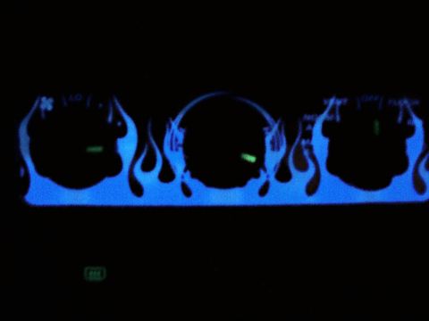 1994 Ford Probe - Custom blue flame graphics adorn the dashboard gauges, obscuring specific year identification.
