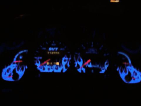 1994 Ford Probe - Custom dashboard gauges with blue flame graphics are visible in this interior shot.