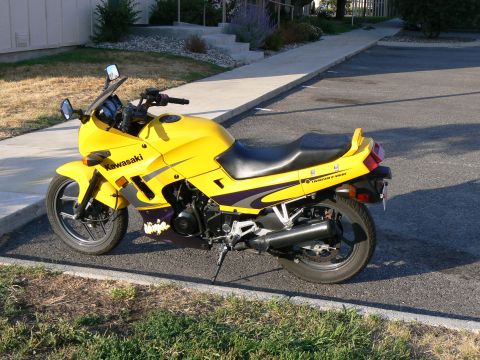2002 Kawasaki Ninja - Side view of a yellow 2002 Kawasaki Ninja motorcycle.