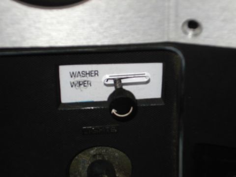 1979 Chevrolet C/K Pickup - Close-up of a dashboard showing a washer wiper control knob and label.