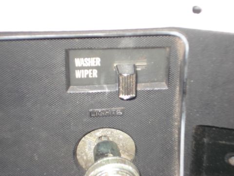 1979 Chevrolet C/K Pickup - Interior view of dashboard controls, including a washer/wiper switch and lights label.