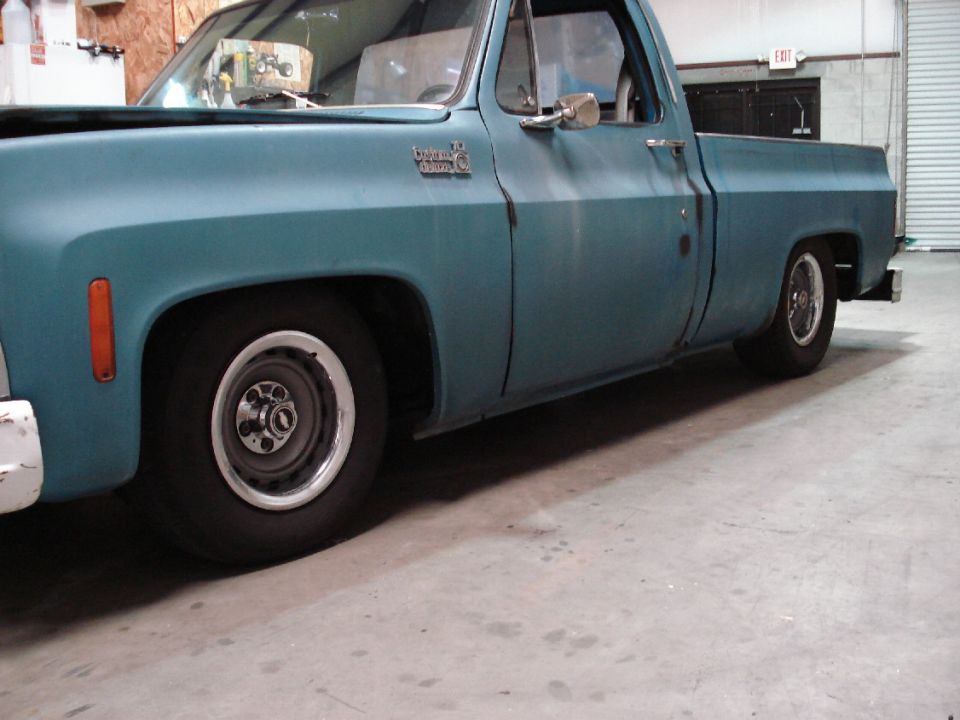 Teal 1979 Chevrolet C/K Pickup truck, side view, showing lowered suspension and aftermarket wheels
