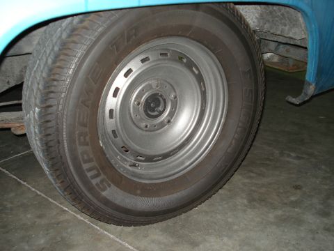 1979 Chevrolet C/K Pickup - Close-up of a blue pickup truck's wheel and tire, identified as a 1979 Chevrolet C/K Pickup.