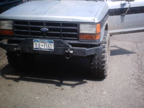 1990 Ford Ranger - The front grille and custom bumper of a 1990 Ford Ranger are visible, along with a New York license plate.
