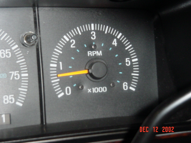 Instrument cluster tachometer reading 0 RPM, x1000 scale to 6, speedometer to 85 at left