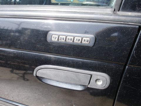 1991 Ford Taurus - Keypad entry system on a car door.