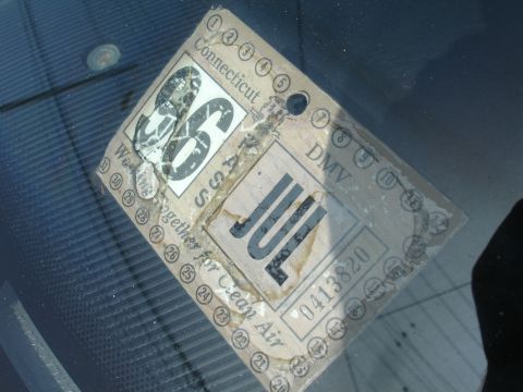 1991 Ford Taurus - A close-up of a Connecticut DMV inspection sticker, indicating the year '86 and the month 'JUL'.