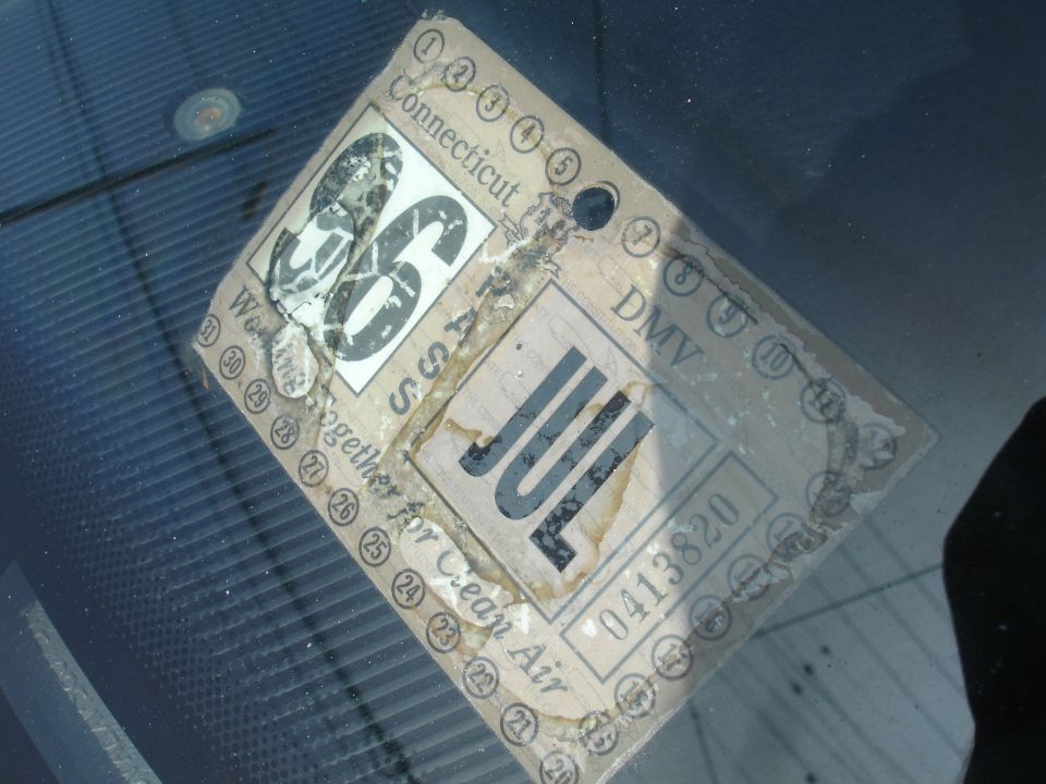 Connecticut DMV sticker showing '86 and 'JUL'