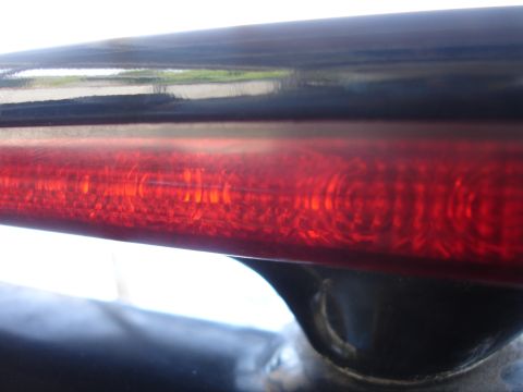 1991 Ford Taurus - A close-up view of a vehicle's red taillight bar, showing its internal LED pattern.