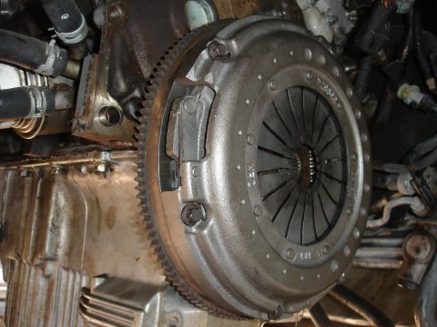 1992 Ford Taurus - Close-up view of a vehicle's clutch and flywheel assembly, part of the engine.