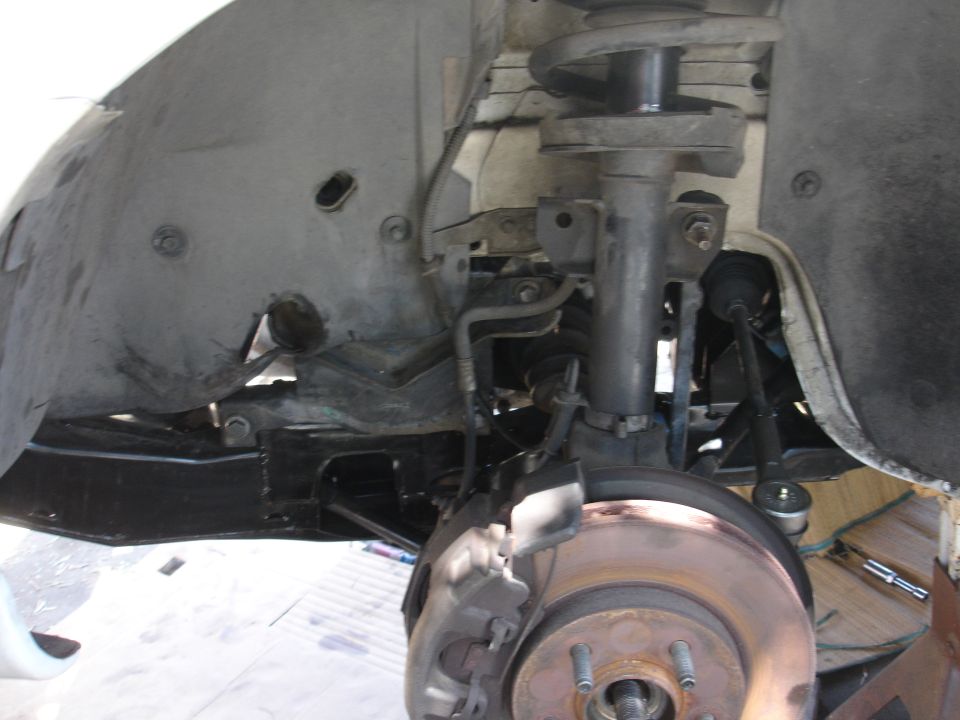 Front suspension underside: strut, coil spring, CV axle and brake rotor