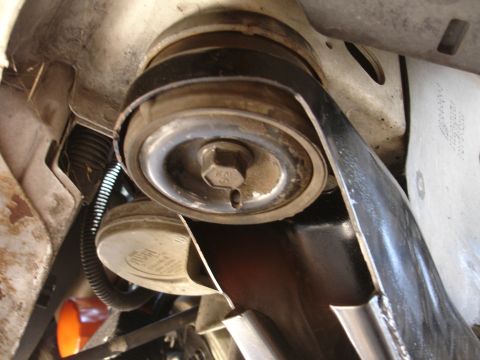 1992 Ford Taurus - Engine belt tensioner pulley assembly detail.