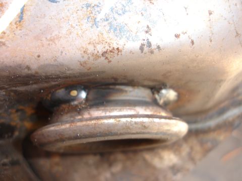 1992 Ford Taurus - A detailed view of a worn suspension component, showing signs of rust and welding.