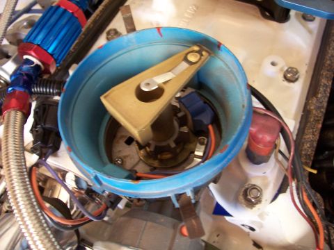 1978 Ford Mustang II - Close-up view of a vehicle's ignition distributor cap and rotor assembly.