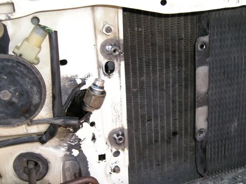 1986 Toyota Hilux - tack welded 2 nuts to mount p/s cooler from econoline between radiator and condensor