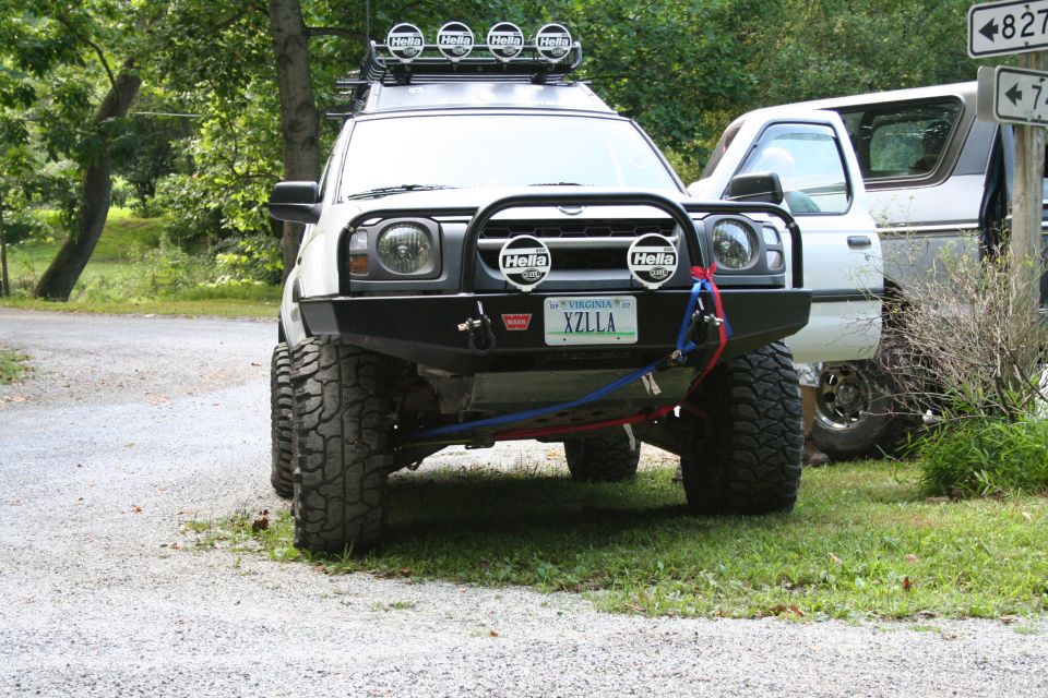Lifted Nissan pickup with roof lights and front bumper guard