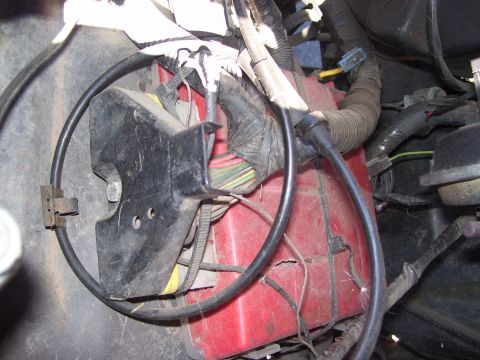 1986 Ford Bronco - Close-up view of wiring and a red box within a vehicle's engine compartment, a Supermotors.net watermark.
