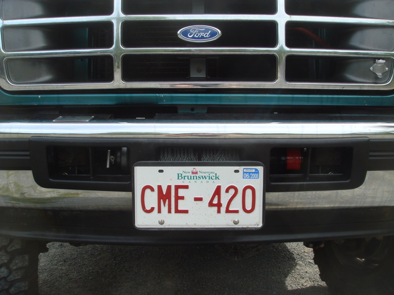 1996 Ford Bronco front end with chrome grille, black bumper, and New Brunswick license plate CME-420