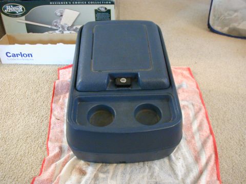 1986 Ford Bronco - Center console part with cup holders and lockable storage compartment.