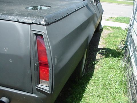 1972 Ford Ranchero - Rear view of a 1972 Ford Ranchero, showing its distinctive taillight and bed cover.