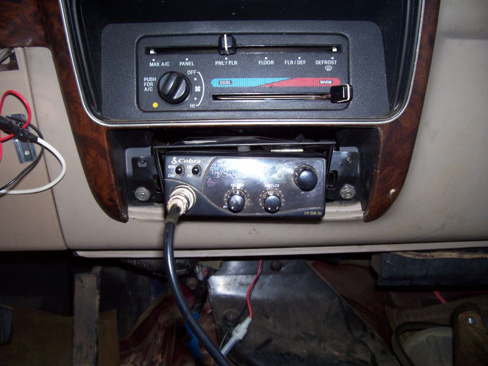 Cobra 19 DX III CB radio installed in a tan dash below slider HVAC controls