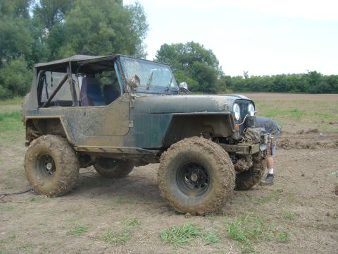 1979 Ford F-250 - This heavily modified Jeep CJ-7 is covered in mud after off-roading.