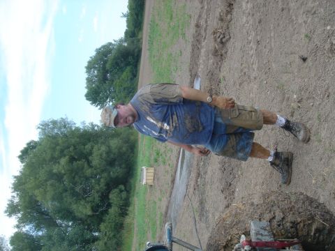 1979 Ford F-250 - A man is covered in mud after working in a field.