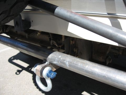 1991 Ford Bronco - Close-up of a custom rear bumper assembly on a vehicle, showing a D-ring tow hook.