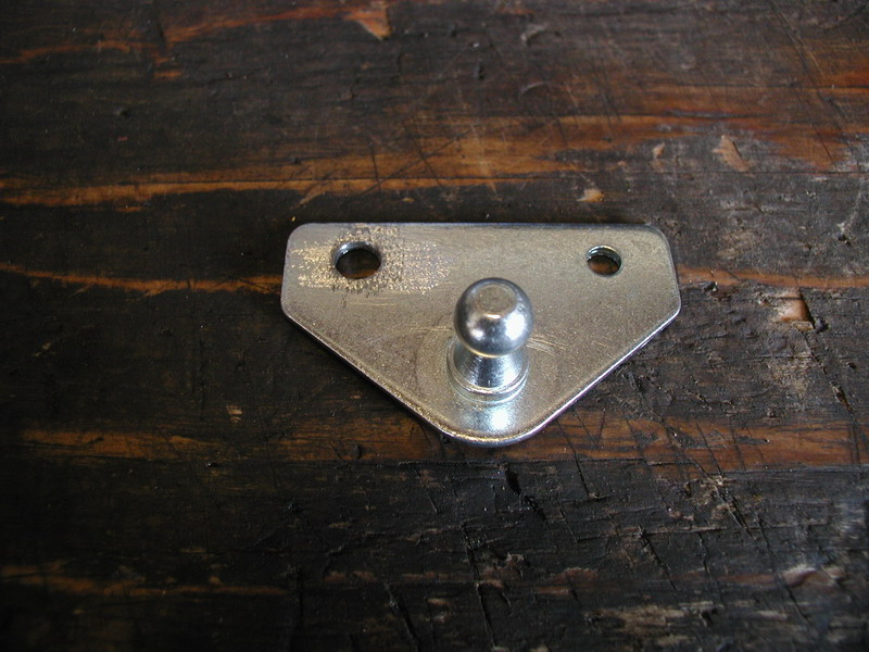 Zinc triangular gas strut bracket with ball stud and two screw holes on wood bench