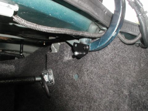 1990 Ford Thunderbird - This photo shows the mounting hardware for a trunk strut, attached to the car's interior structure.