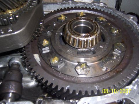 1994 Ford Probe - LSD installed. I put a dab of grease on each bolt and installed top half of trans case. I then rotated the first gear shaft which rotated t…