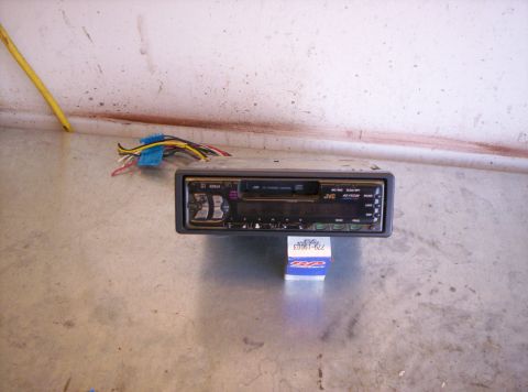 1995 Ford Bronco - A JVC single-DIN car stereo head unit with CD-changer control and 40W x 4 output, propped on a small blue parts box on a concrete garage fl…