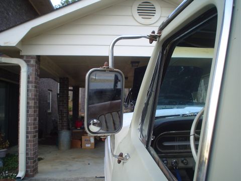 1967 Ford F-250 - View of the side mirror and dashboard of a 1967 Ford F-250 truck.